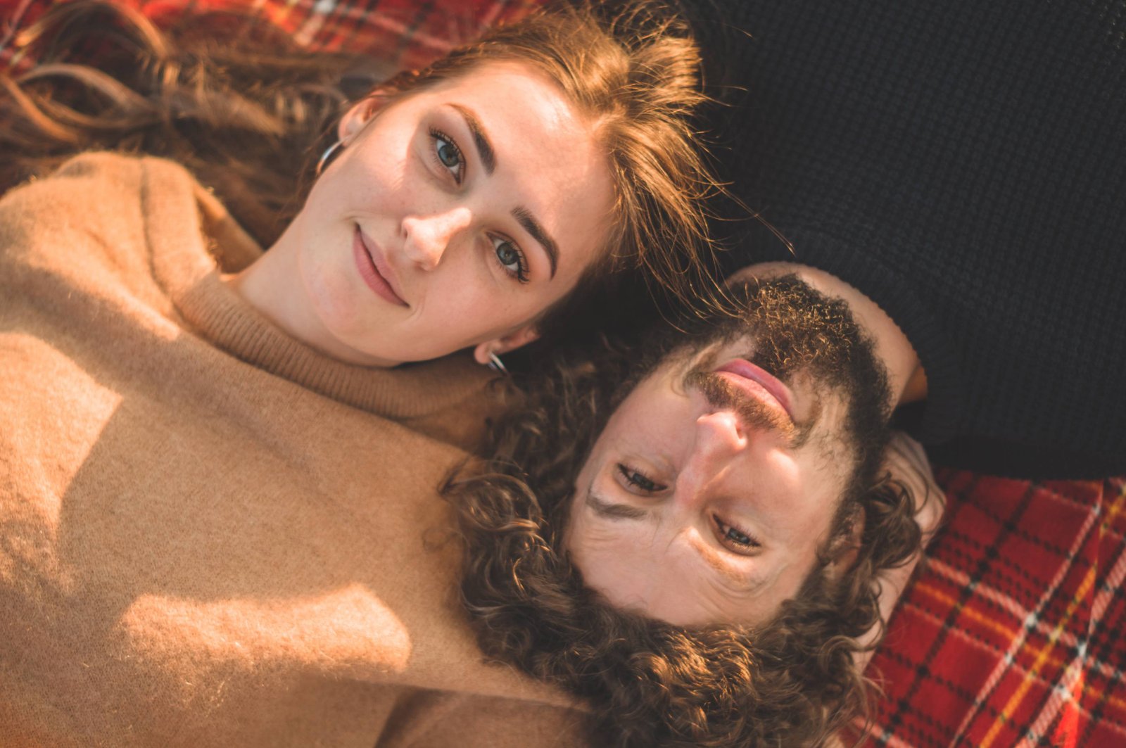 A couple relaxing together in warm sunlight